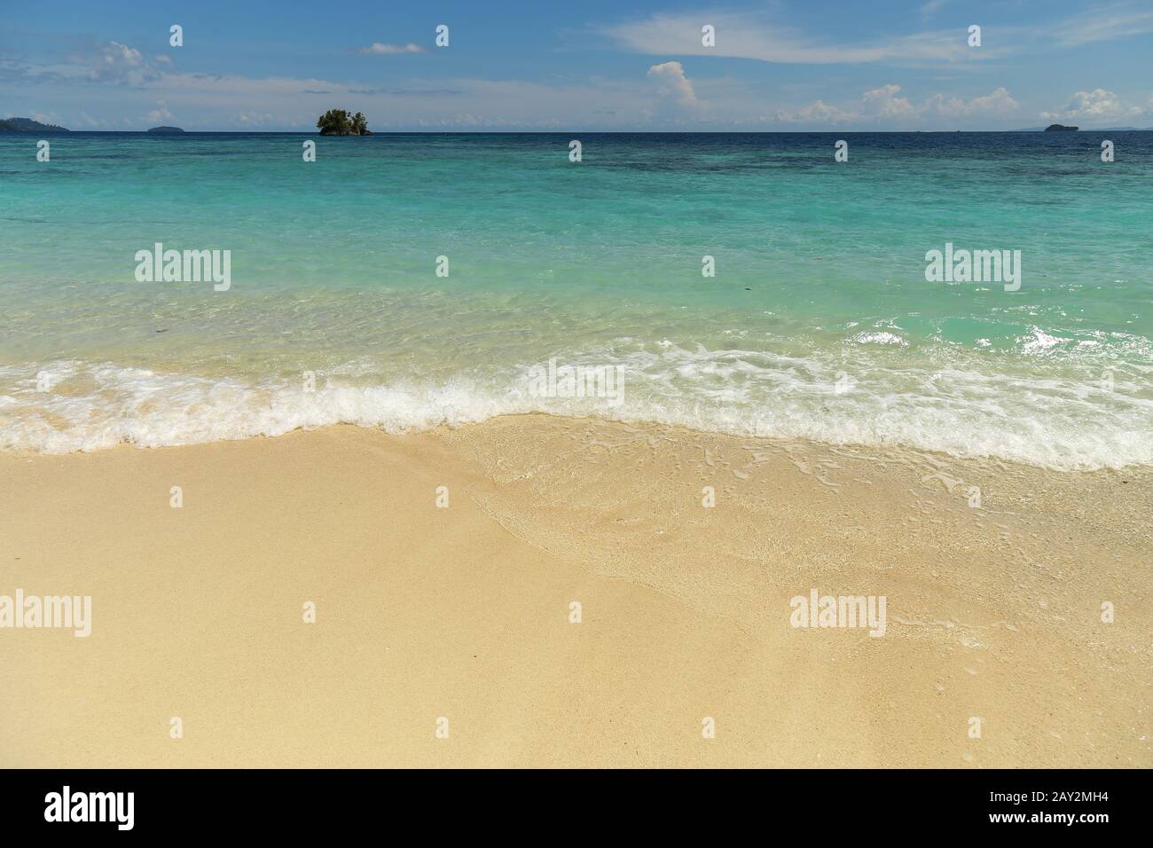 Beautiful view of a wild tropical beach in sunny day. Raja Ampat Stock Photo