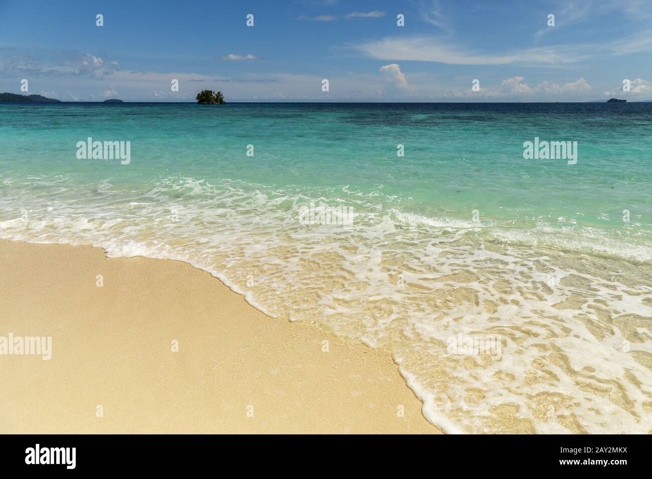 Beautiful view of a wild tropical beach in sunny day. Raja Ampat Stock Photo