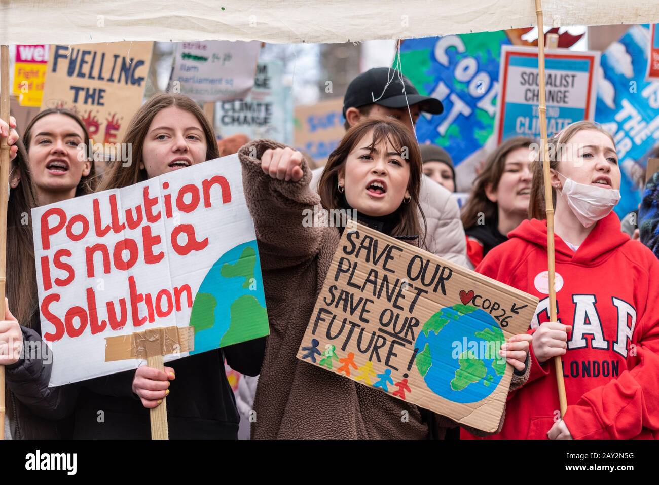 Parliament Square, London, UK. 14th Feb, 2020. One year after the first UK youth climate strike youngsters are again protesting to demand climate action. They believe that governments are not acting fast enough to reverse the damage to the climate. Many skipped their education to attend Stock Photo