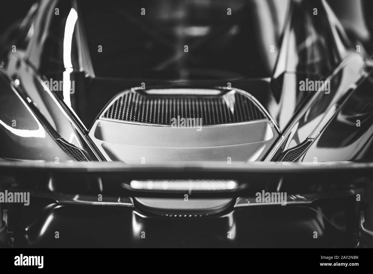 Back view of the spoiler and trunk of a sports car in black and white Stock Photo