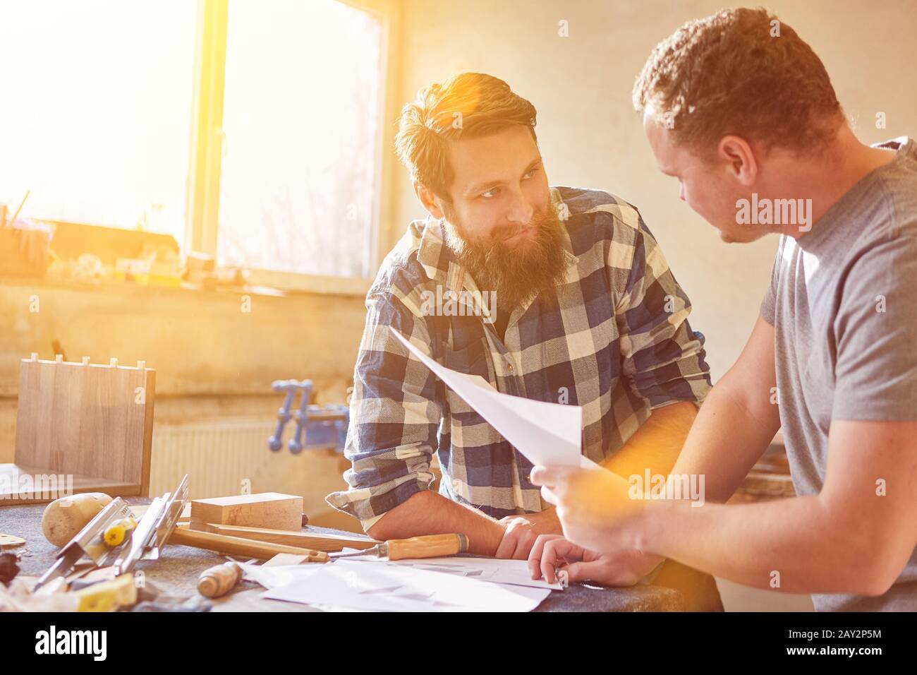Two carpenters plan an order and delivery to the joinery Stock Photo