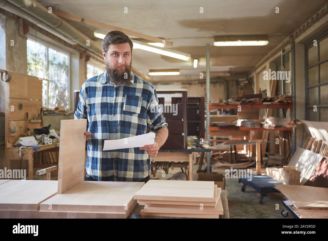 Furniture maker with shelves and checklist for ordering in the carpentry Stock Photo