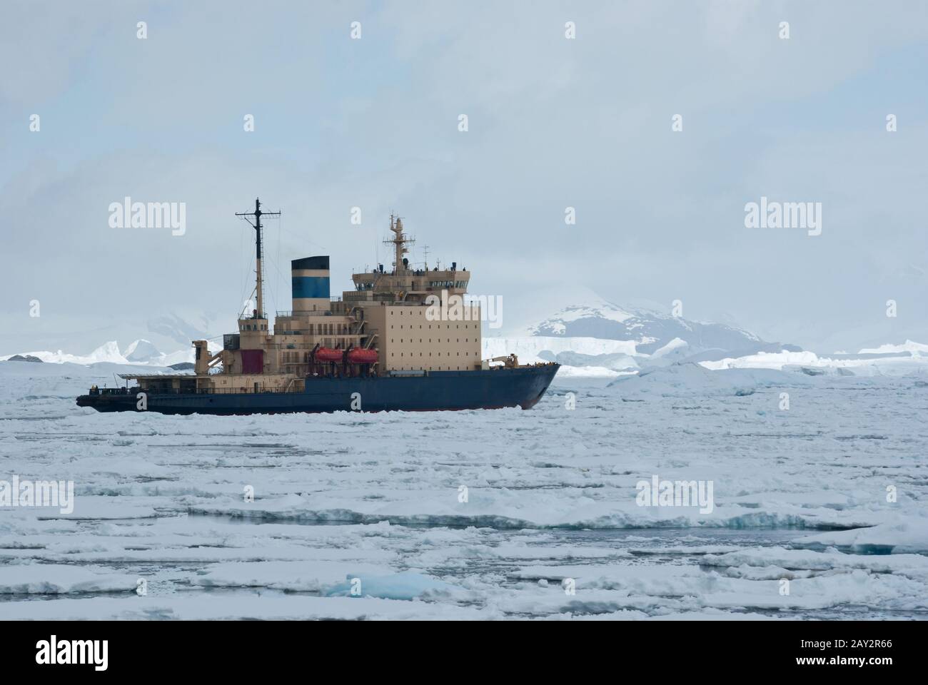 icebreaker which floats on the frozen Strait spring Antarctic mountains ...