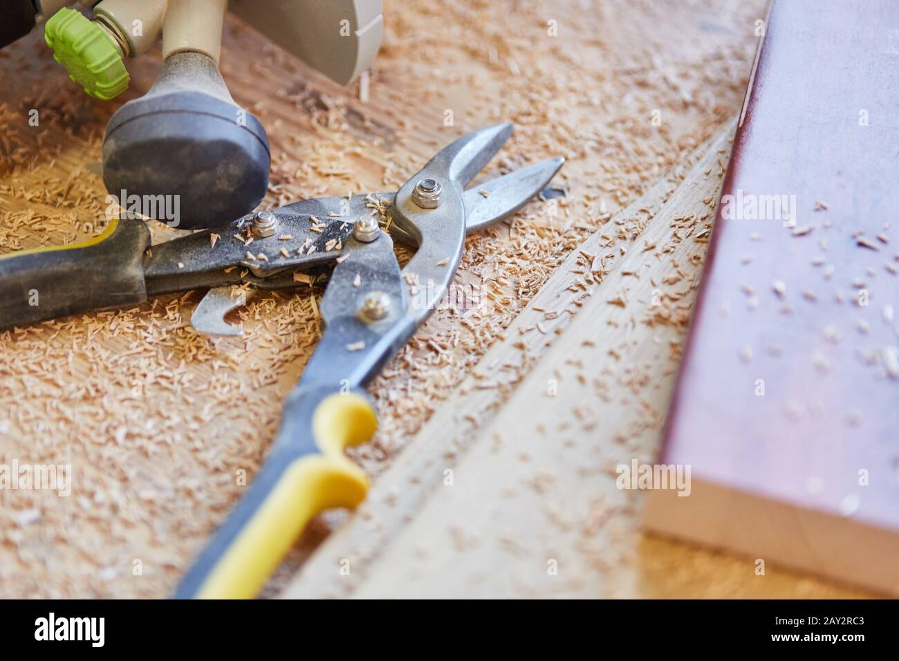 Side cutters and wood shavings between tools in a joinery Stock Photo