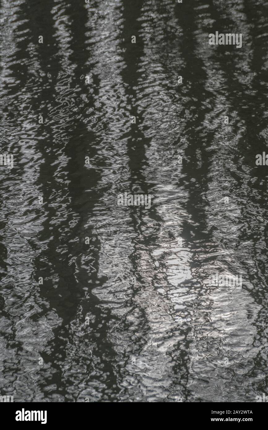 Slightly turbulent water ripples on the River Fowey at Lostwithiel. For ...