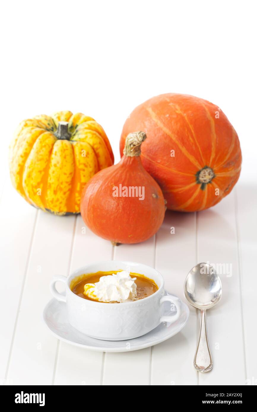 Pumpkin soup on white background Stock Photo - Alamy