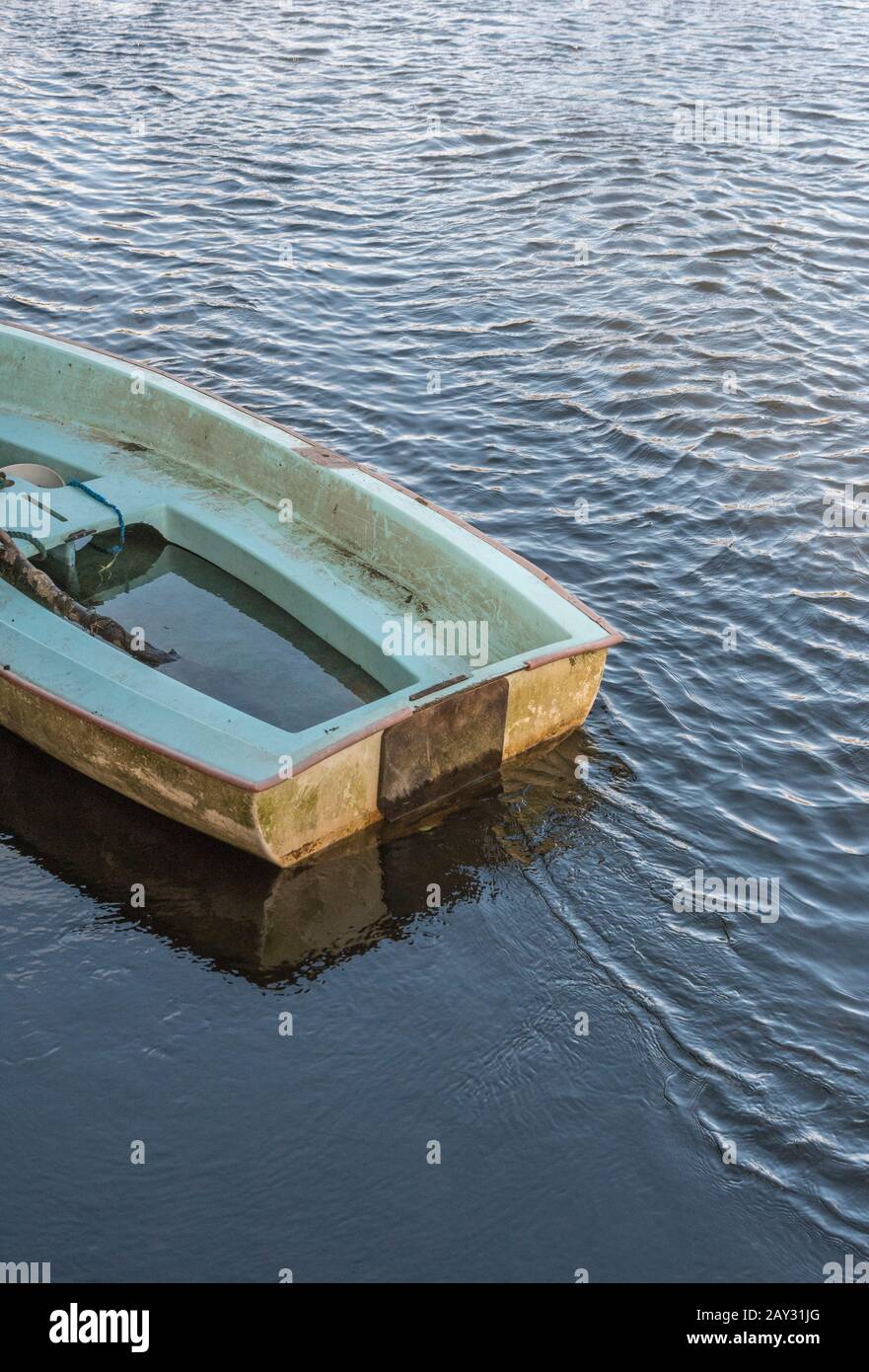 Waterlogged boat for 'sinking ship', 'sink the boat', going down with the ship, organisational failure, crisis management, emergency plan, be prepared Stock Photo