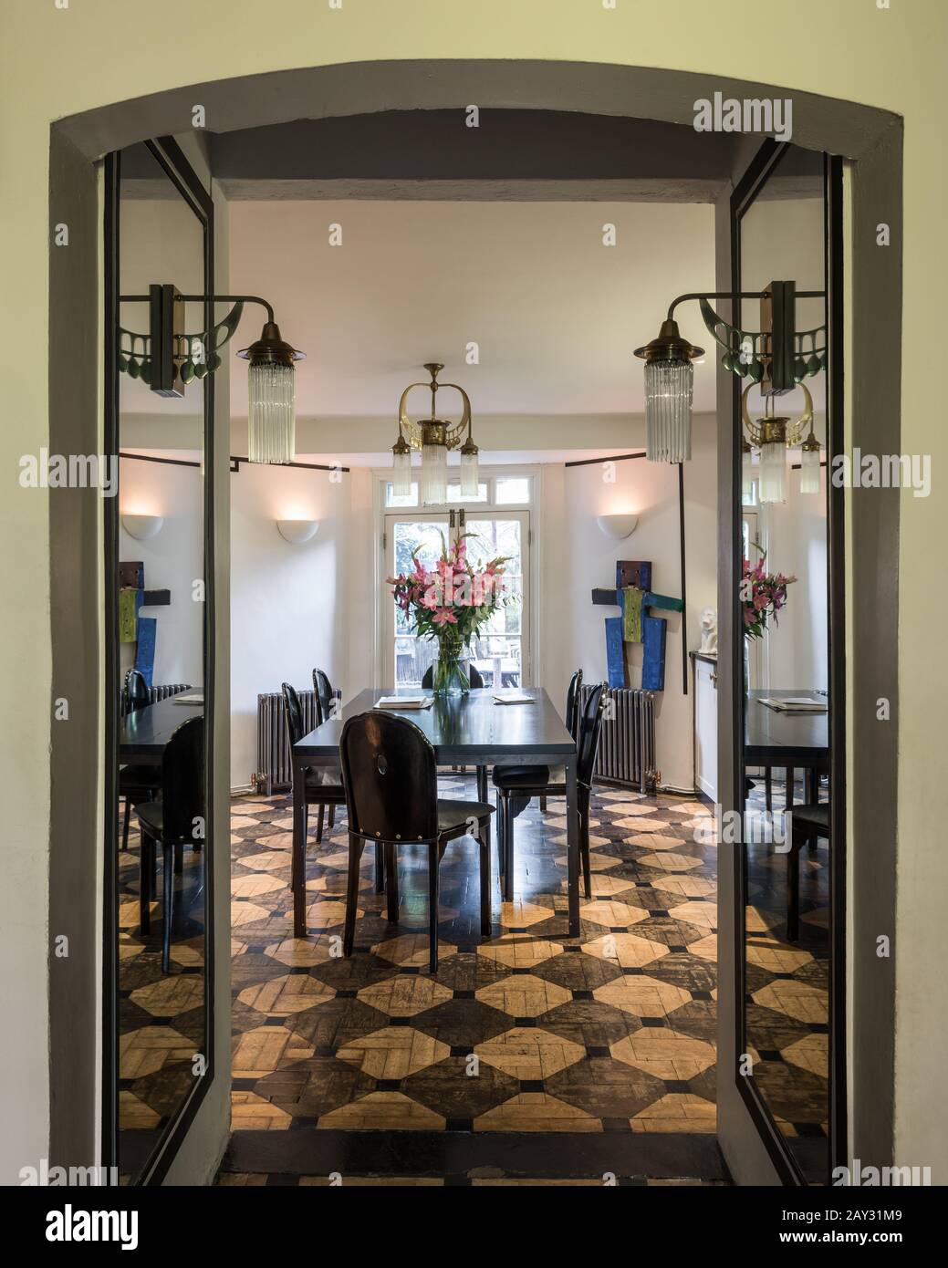 Open doors to modern dining room Stock Photo