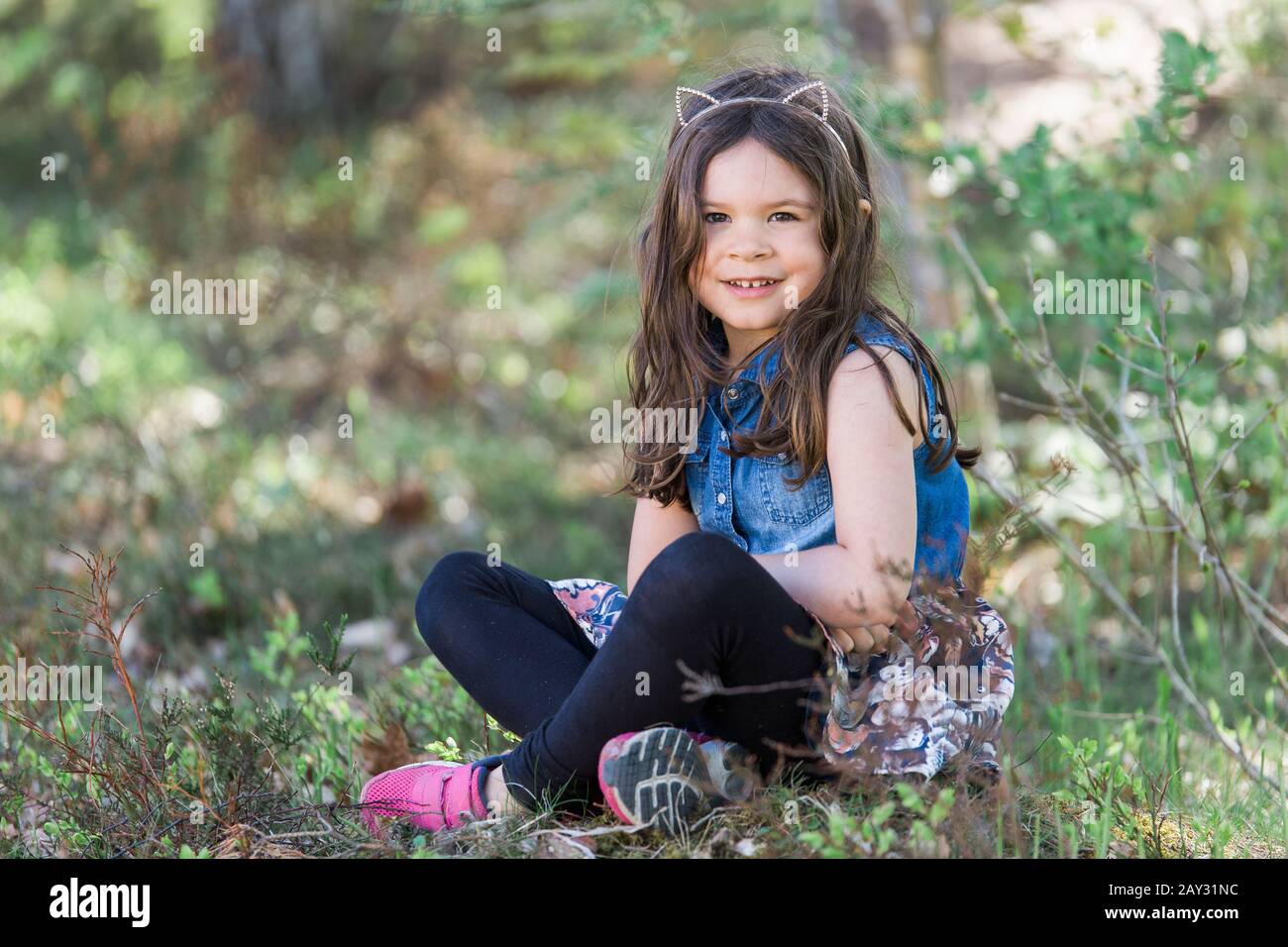 Smiling girl looking at camera Stock Photo - Alamy