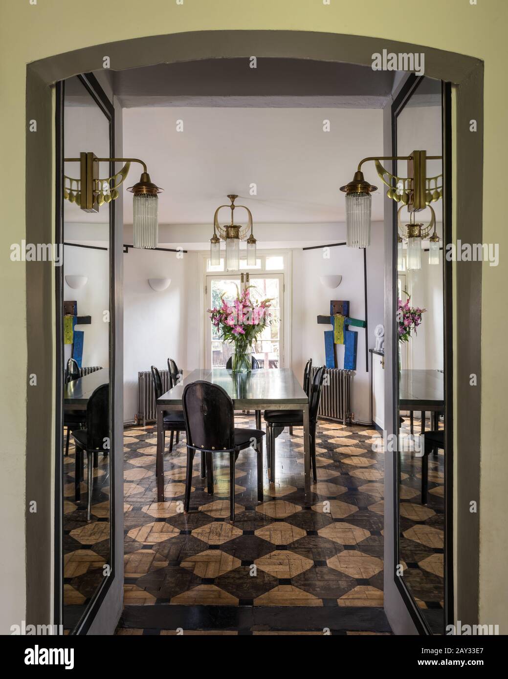 Open doors to modern dining room Stock Photo