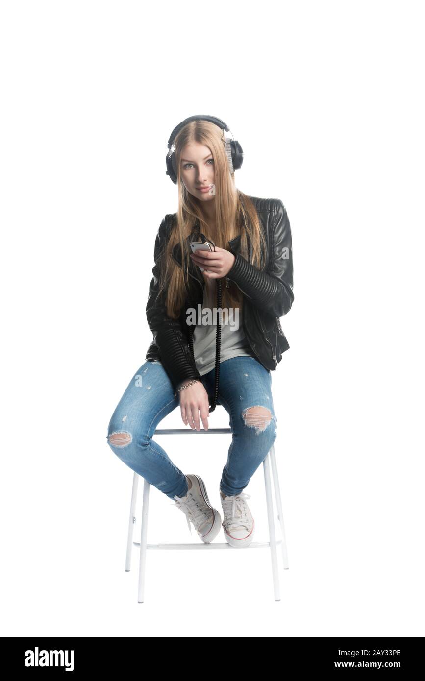 Isolated on white girl portrait in wired headphone Stock Photo