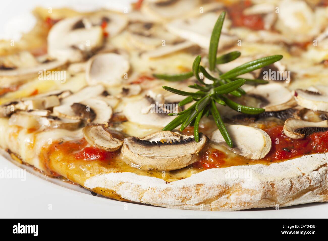 Italian Pizza Funghi on a white plate Stock Photo