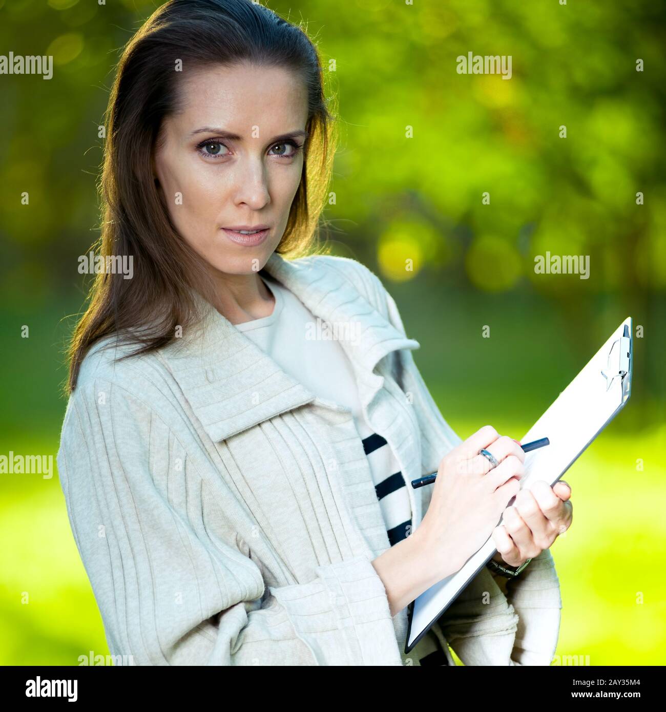 Portrait of smiling business woman with paper folder. Student Stock ...