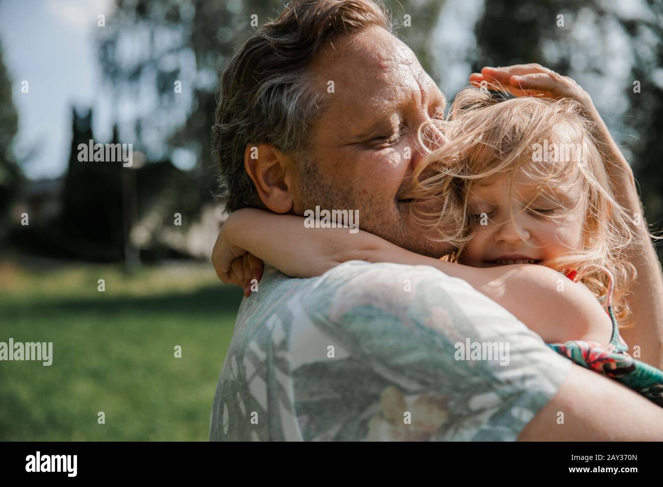 Father and daughter hugging Stock Photo