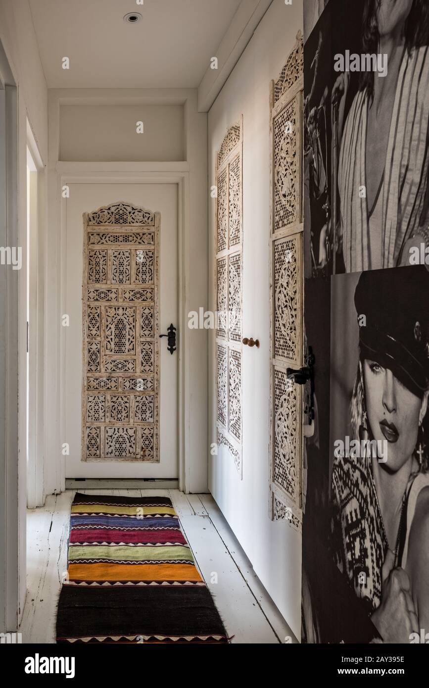 Photograph of Madonna and panels in hallway Stock Photo