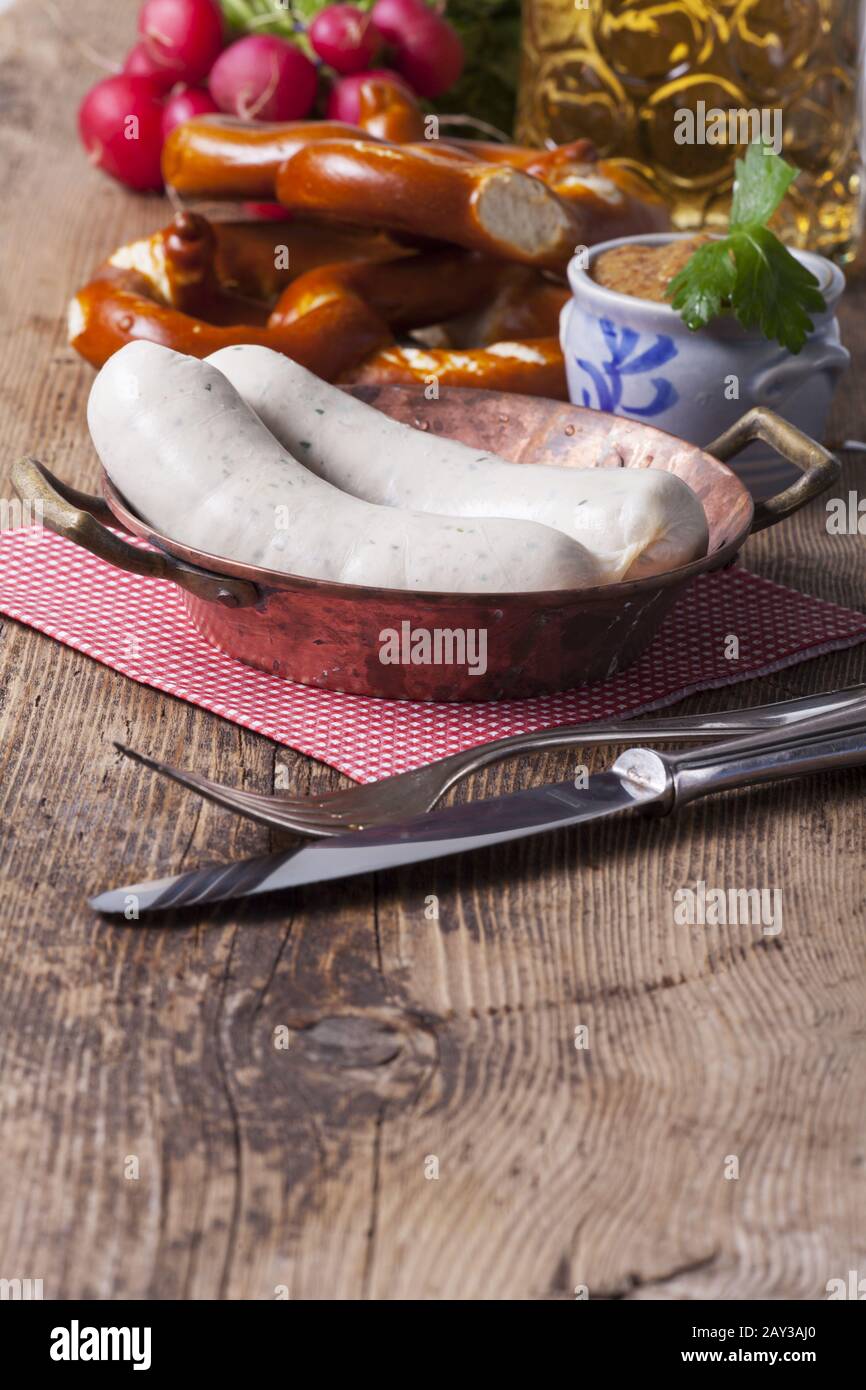 Bavarian veal sausage in a copper pot Stock Photo Alamy