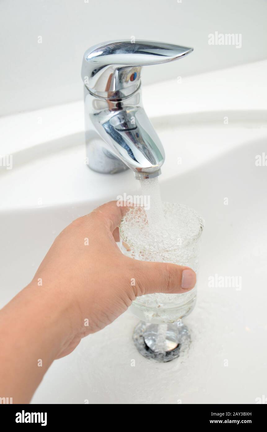 Glass filled with drinking water from tap Stock Photo Alamy