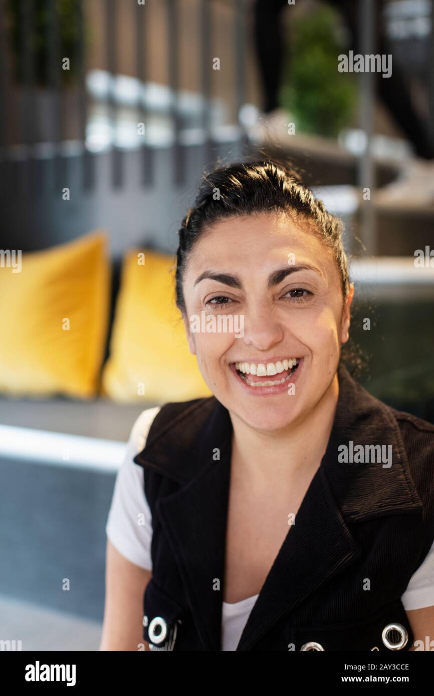 Happy woman looking at camera Stock Photo