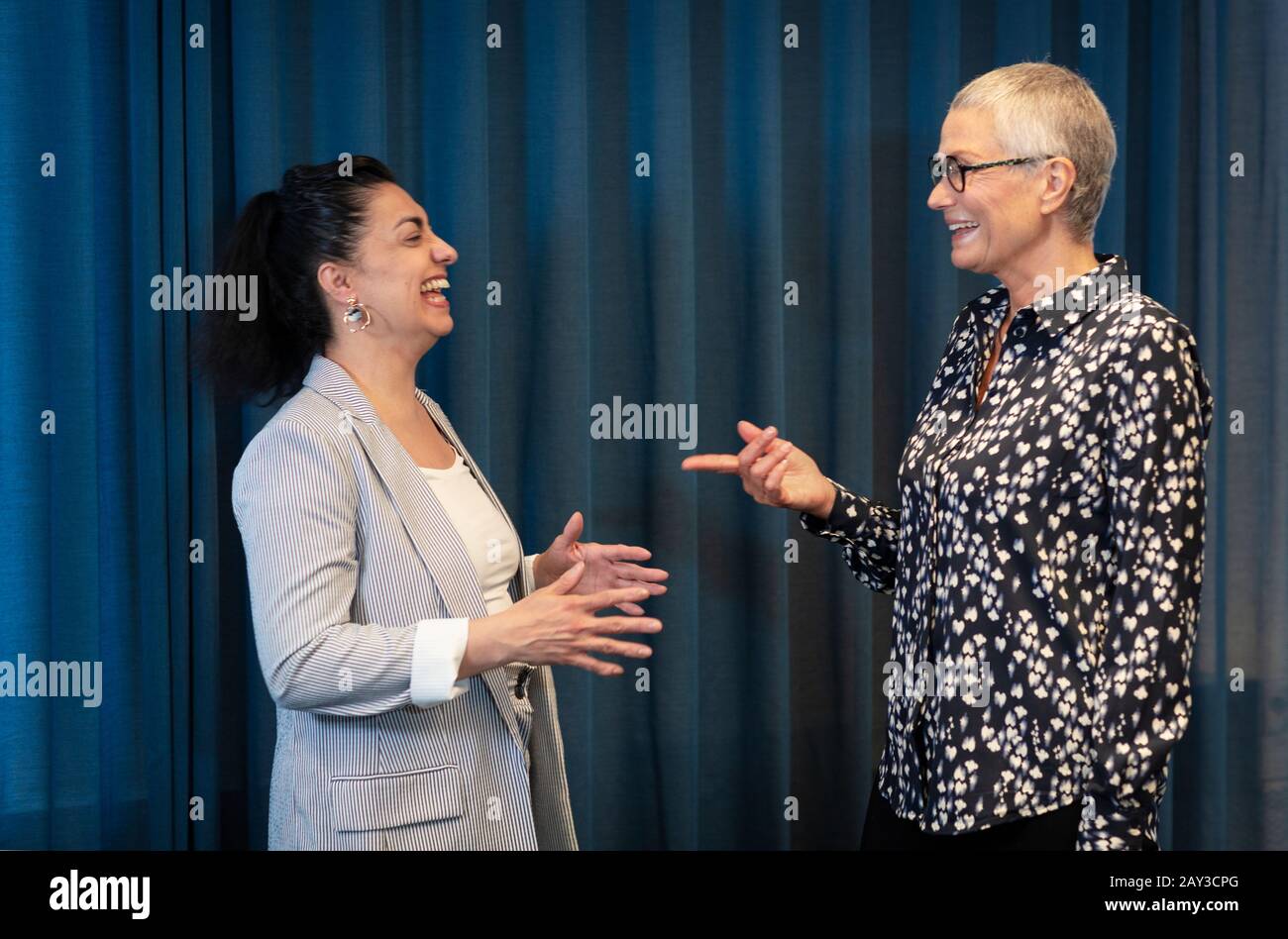 Businesswomen talking together Stock Photo