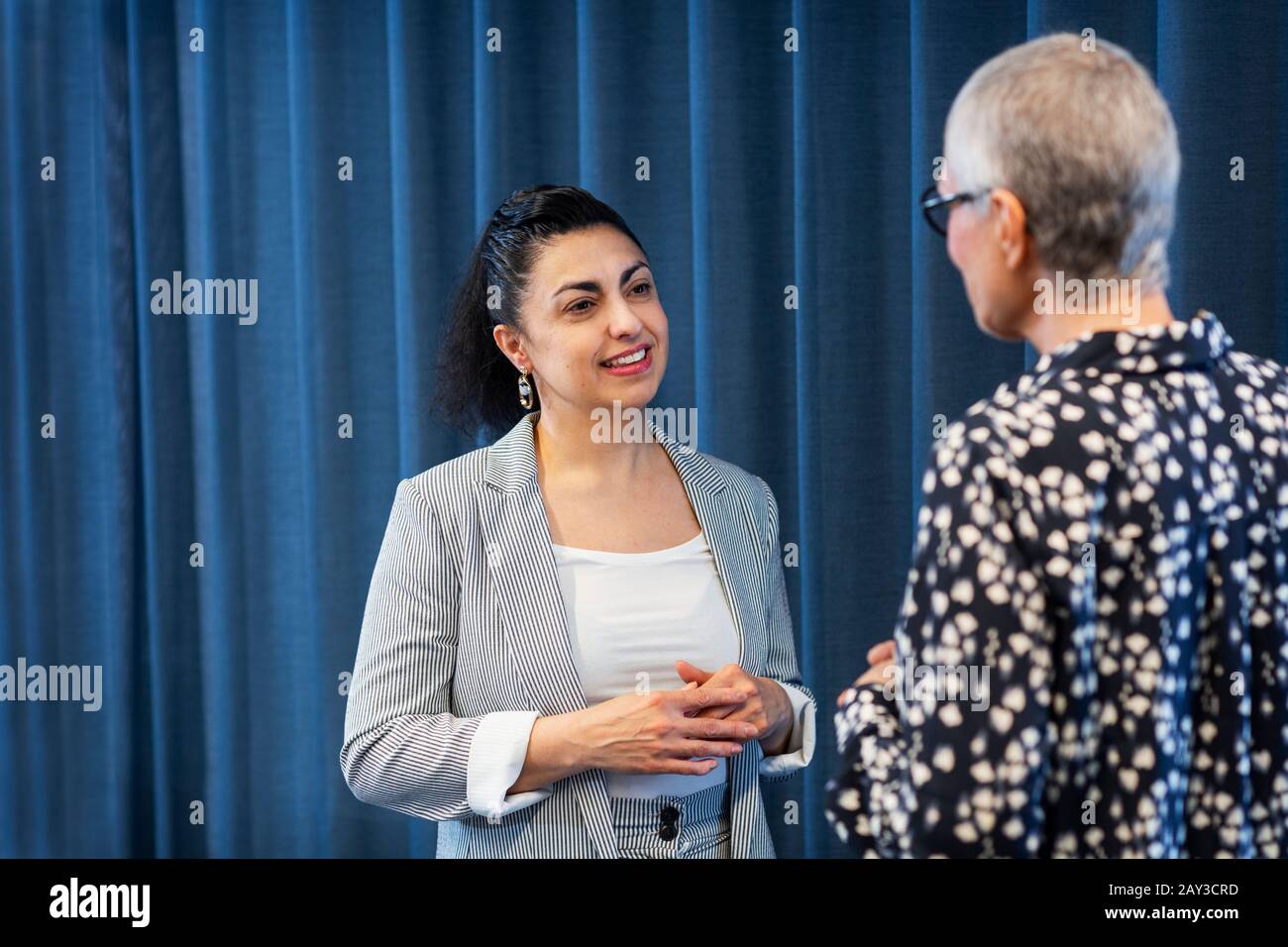 Businesswomen talking together Stock Photo