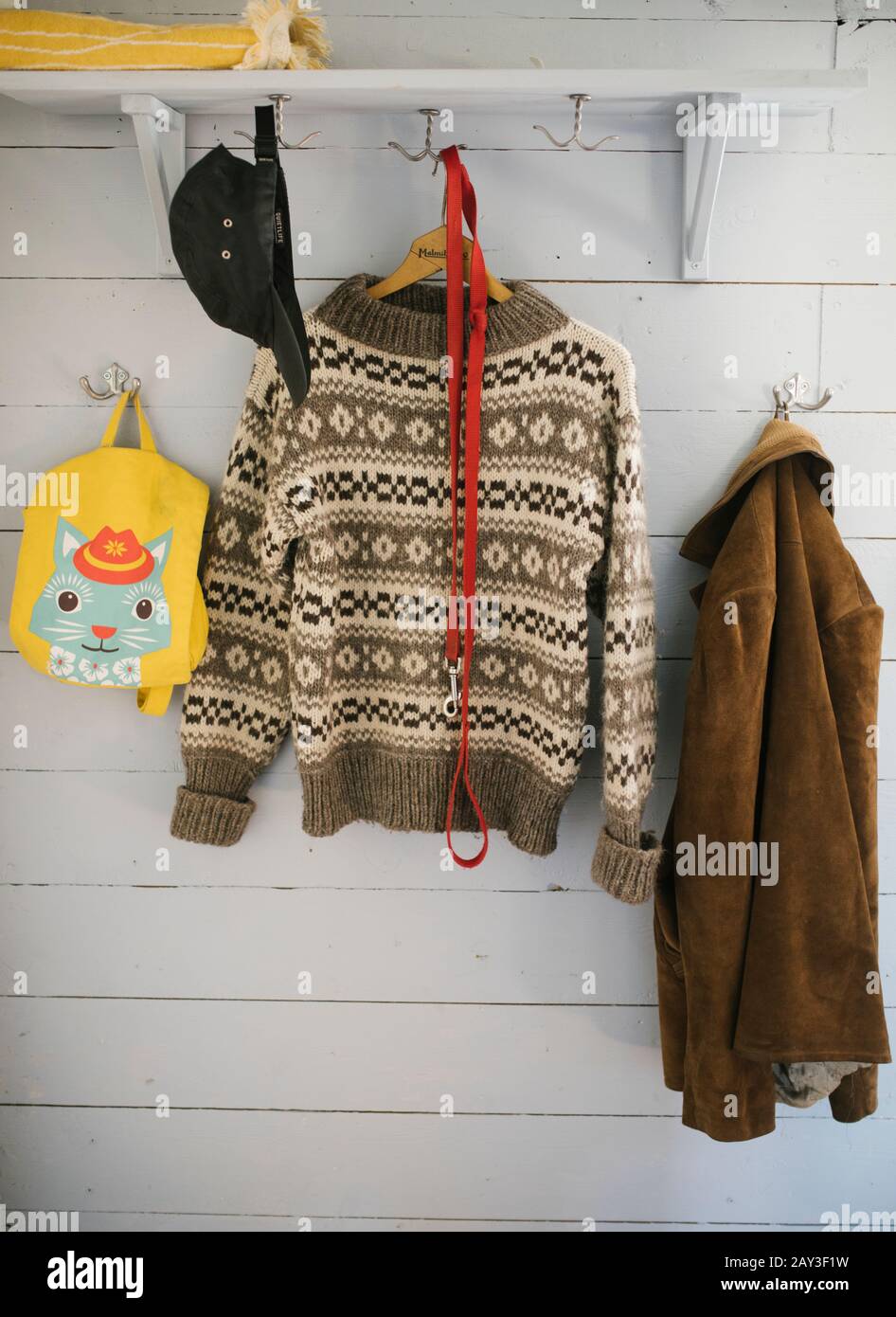 Clothes hanging on hooks Stock Photo Alamy