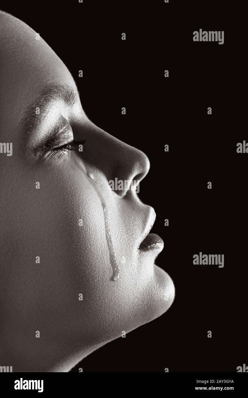 Sad Girl Profile In Dark Looking Up Stock Photo, Picture and