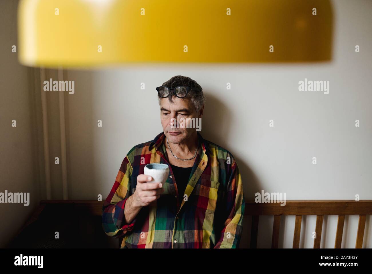 Man at table looking away Stock Photo