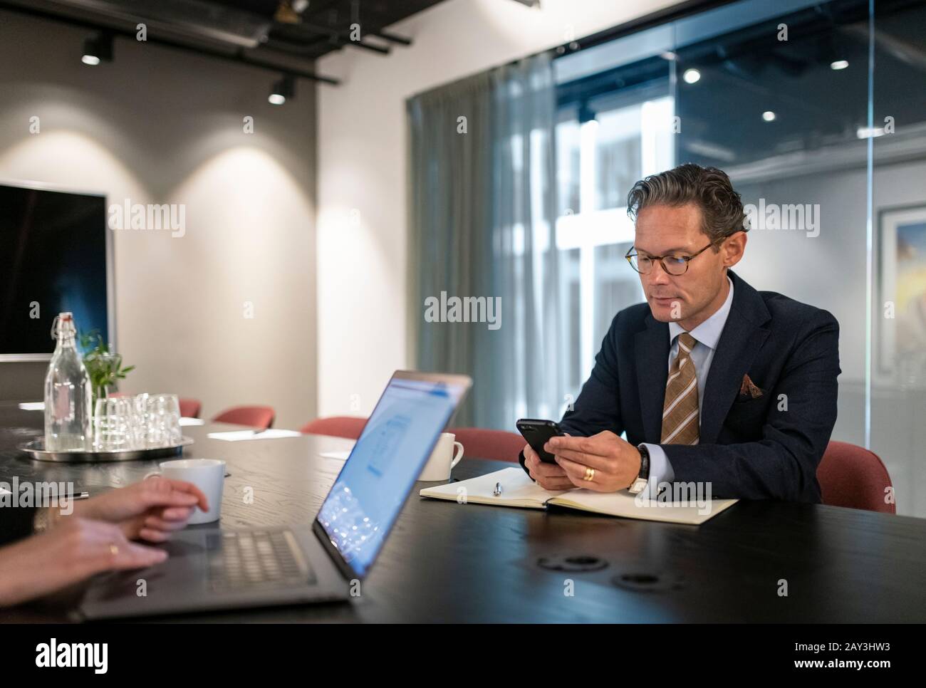 Mature businessman using cell phone Stock Photo