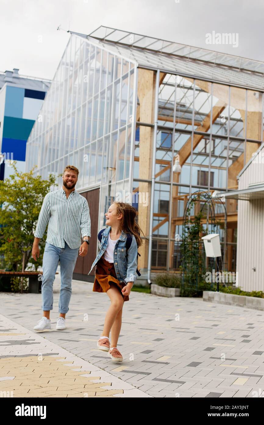 Father and daughter walking together Stock Photo - Alamy