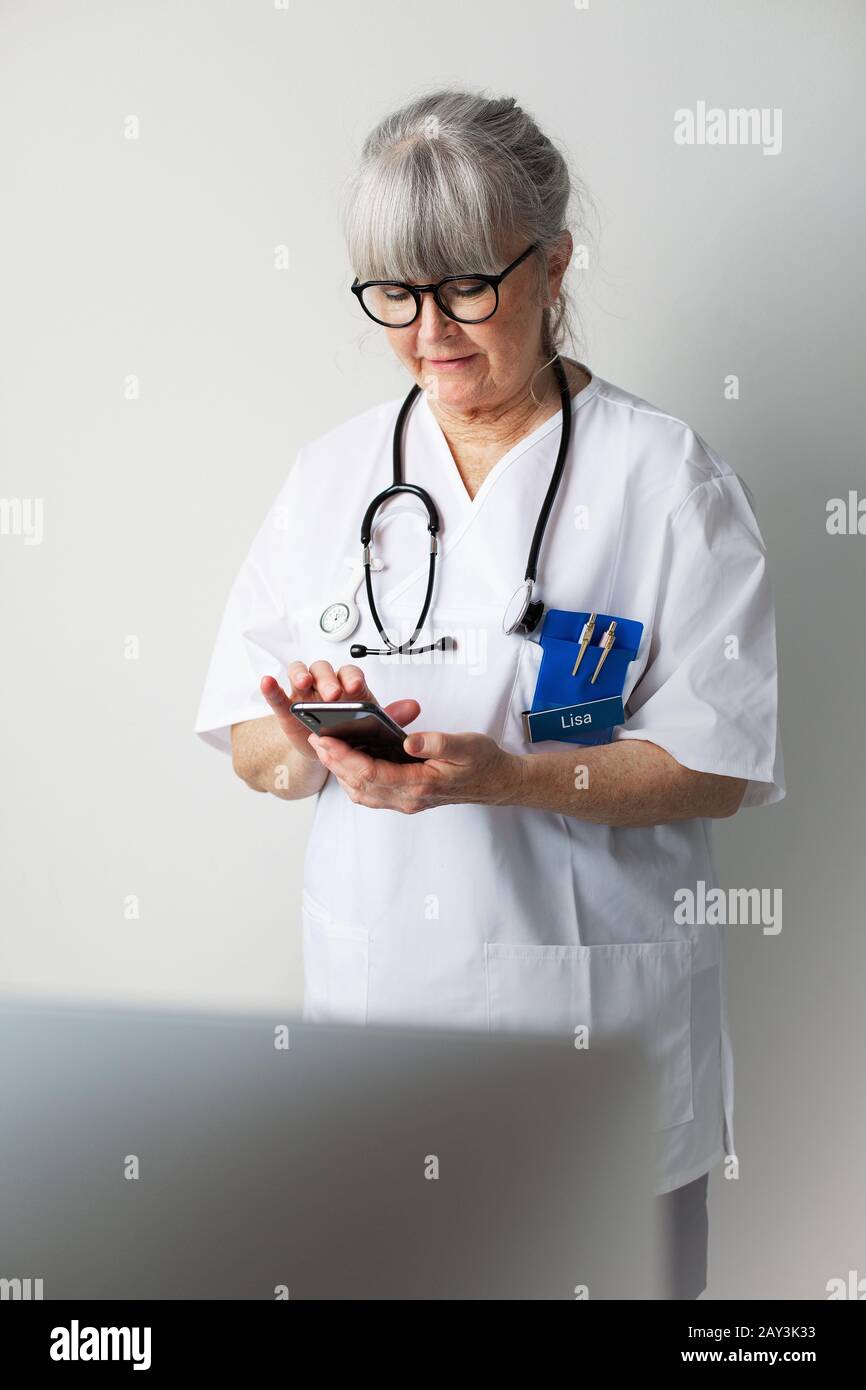 Woman doctor grey hair using hi-res stock photography and images - Alamy