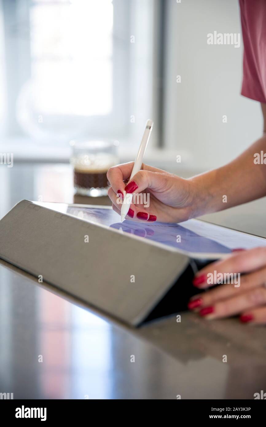 Hands using digital tablet Stock Photo