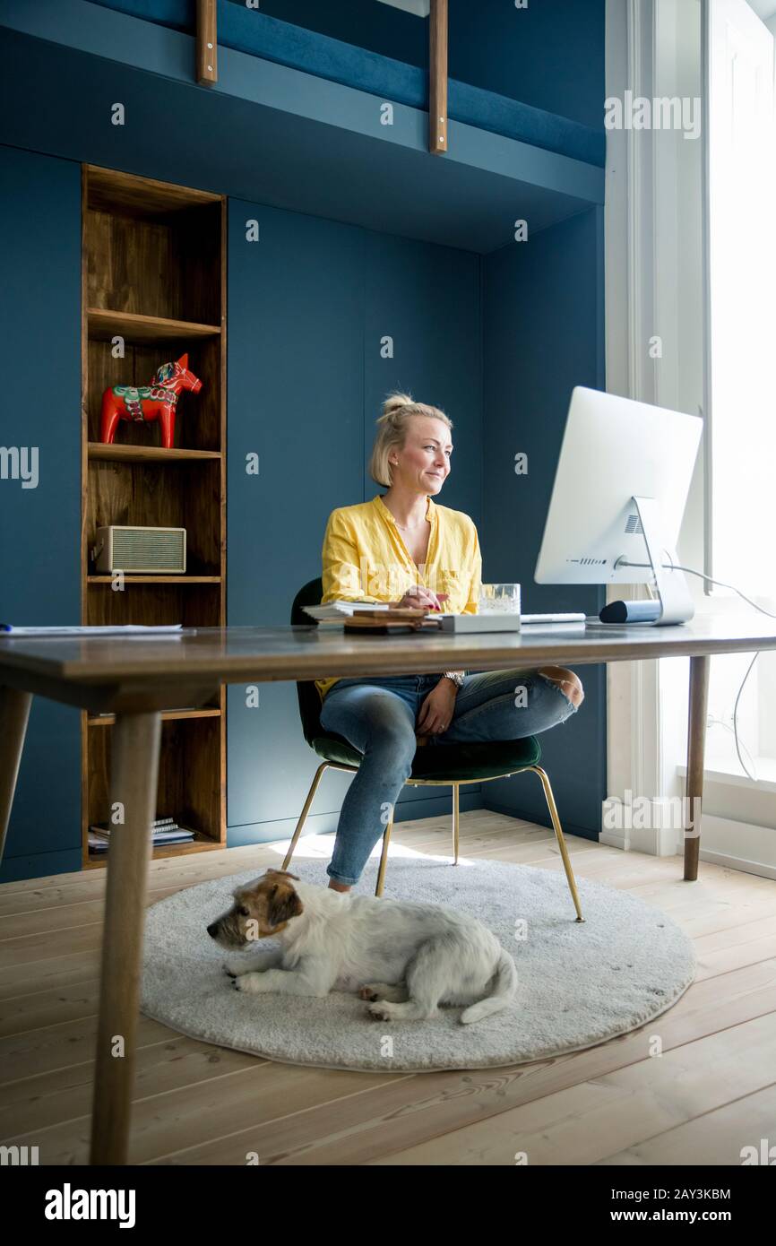 Woman in office using computer Stock Photo