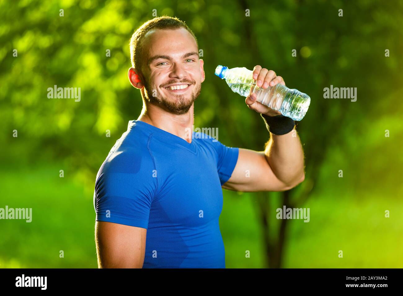 Athletic mature man drinking water from a bottle Stock Photo