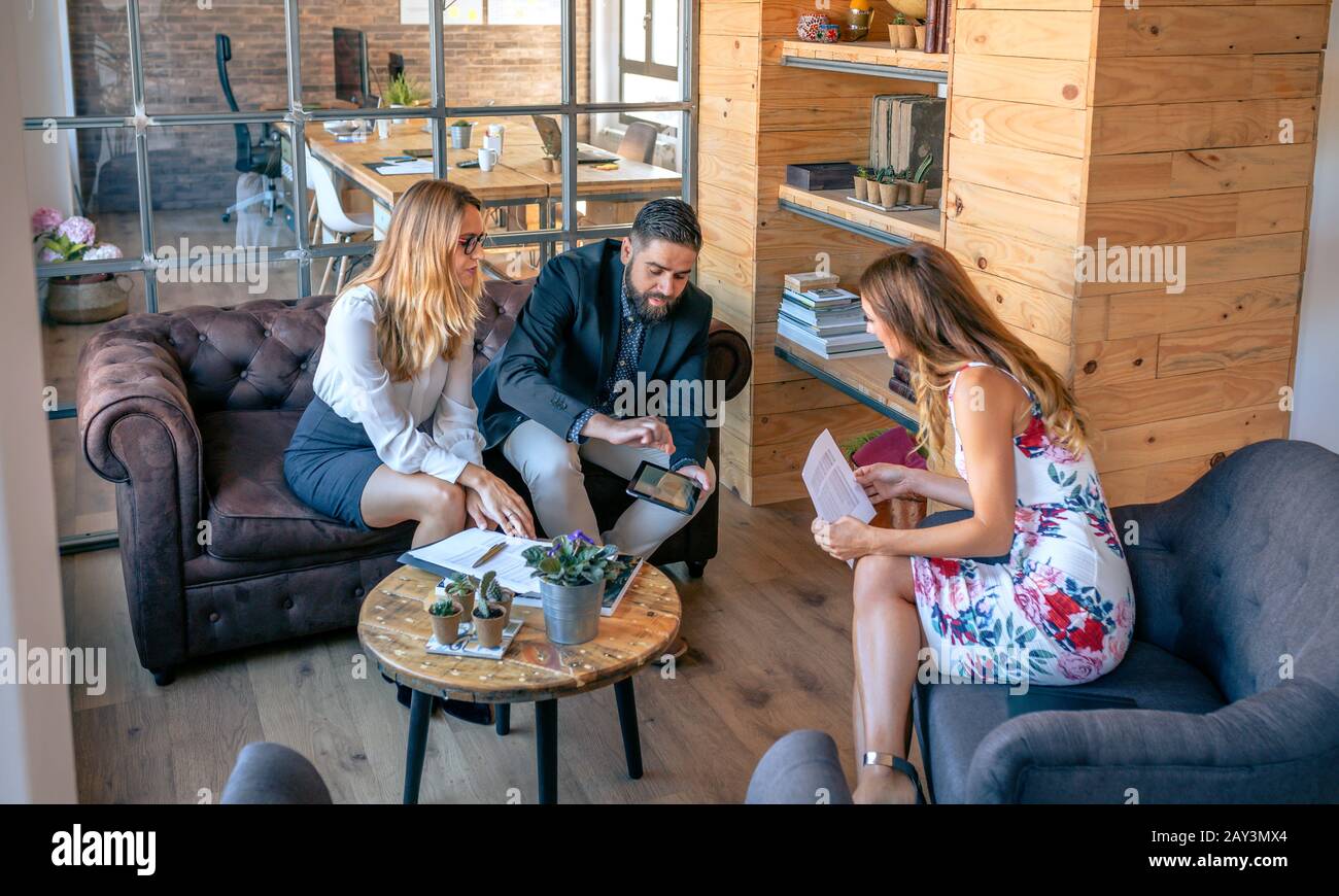 Businesspeople having an informal work meeting Stock Photo