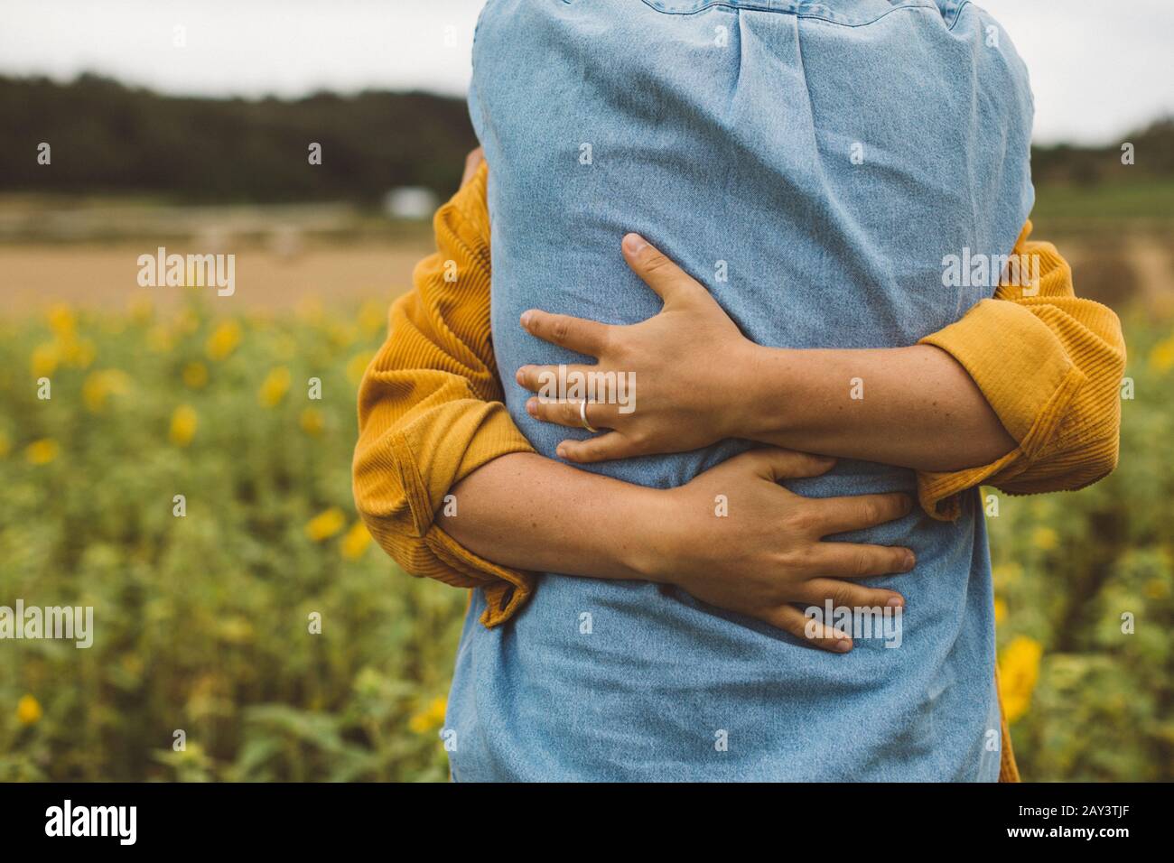 Couple hugging, mid section Stock Photo