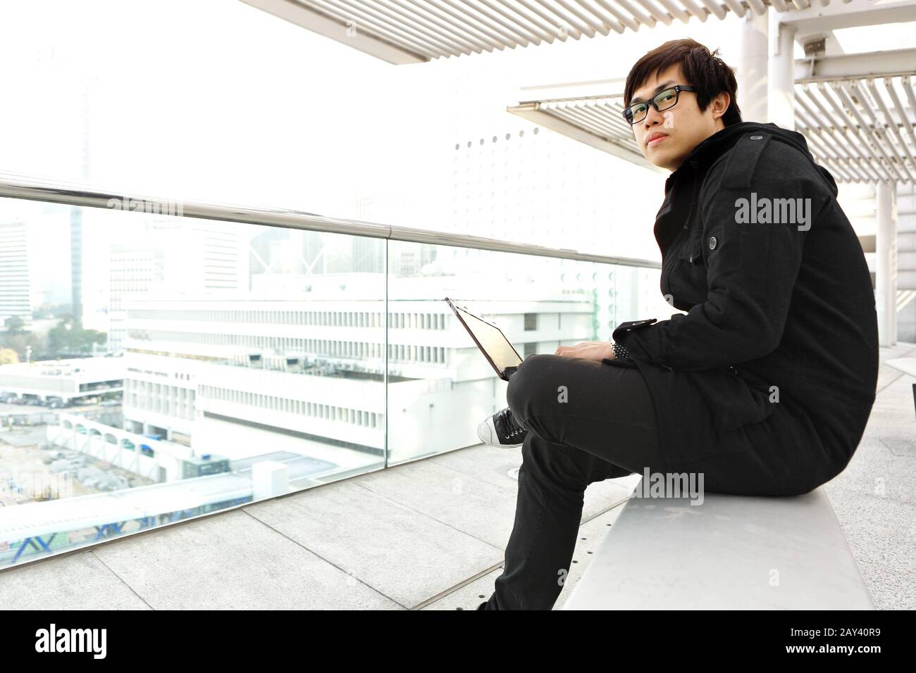 man using computer outdoor Stock Photo - Alamy