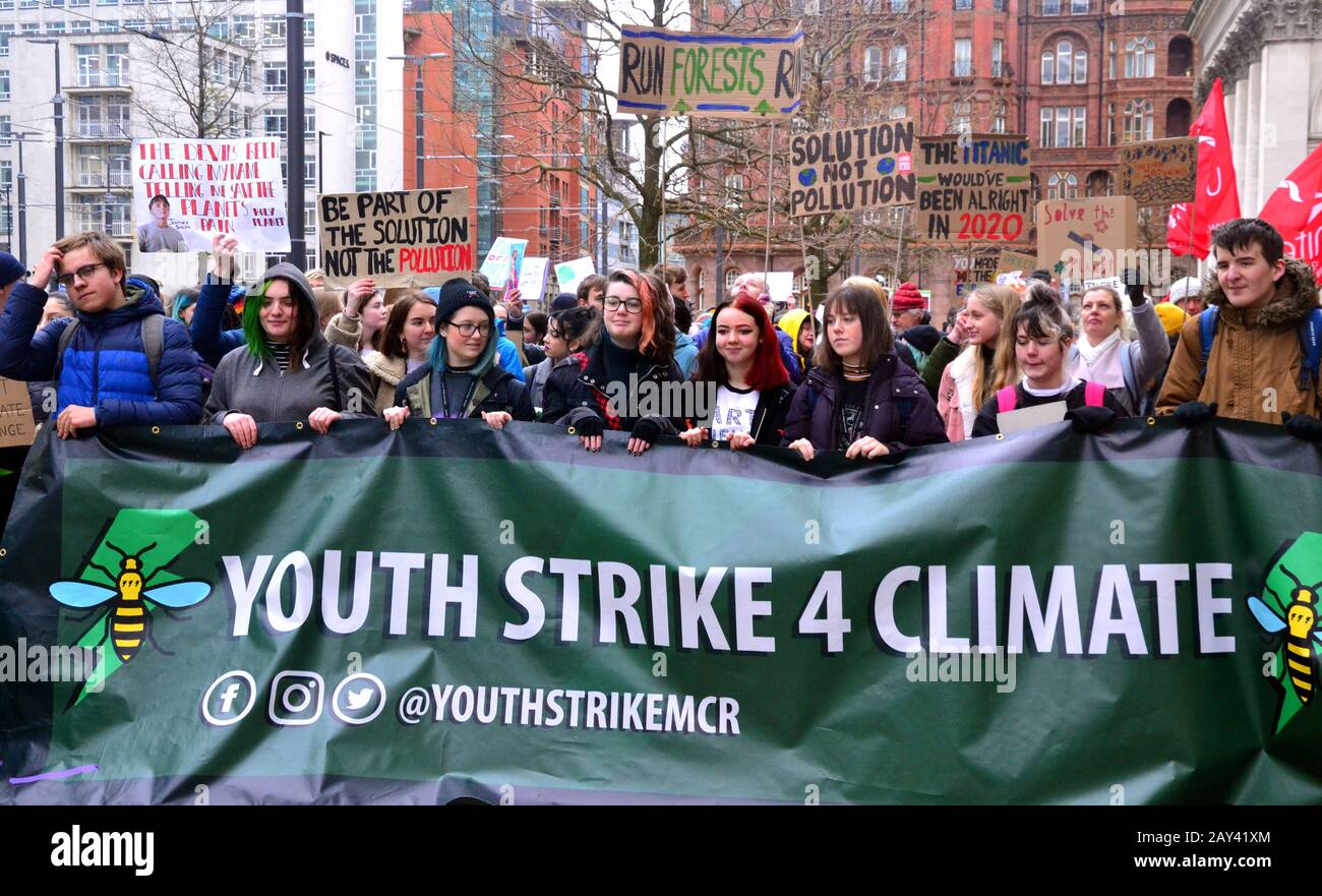Young people march through city centre Manchester, United Kingdom, lobbying for action to prevent climate change at the  Youth Strike 4 Climate protest on 14th February, 2020, in Manchester, uk.  The organisers say: 'Student Climate Network (UKSCN) is a group of mostly under 18s taking to the streets to protest the government’s lack of action on the Climate Crisis. We are mobilising unprecedented numbers of students to create a strong movement and send a message that we are tired of being ignored.' Stock Photo