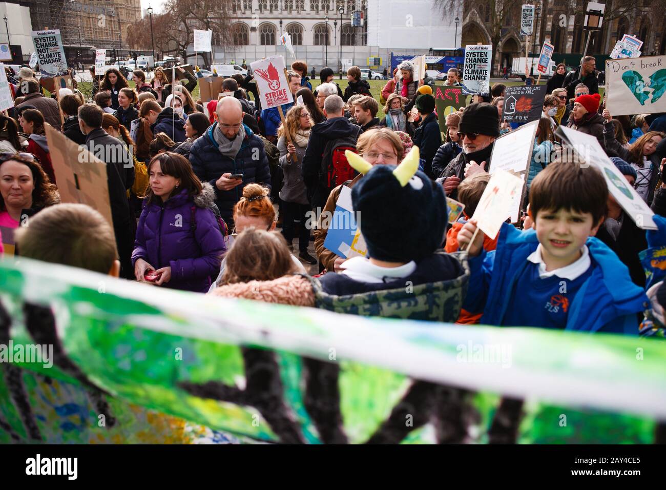 Young environmentalists gather during the protest at Parliament Square in London.Hundreds of thousands of schoolchildren took to the streets in cities around the world to call for greater action from governments to tackle the climate crisis. Several such coordinated global events have since been held, with worldwide climate activism over the past year further bolstered by the tandem growth of the Extinction Rebellion movement, whose direct action protests are set to continue throughout 2020. Stock Photo