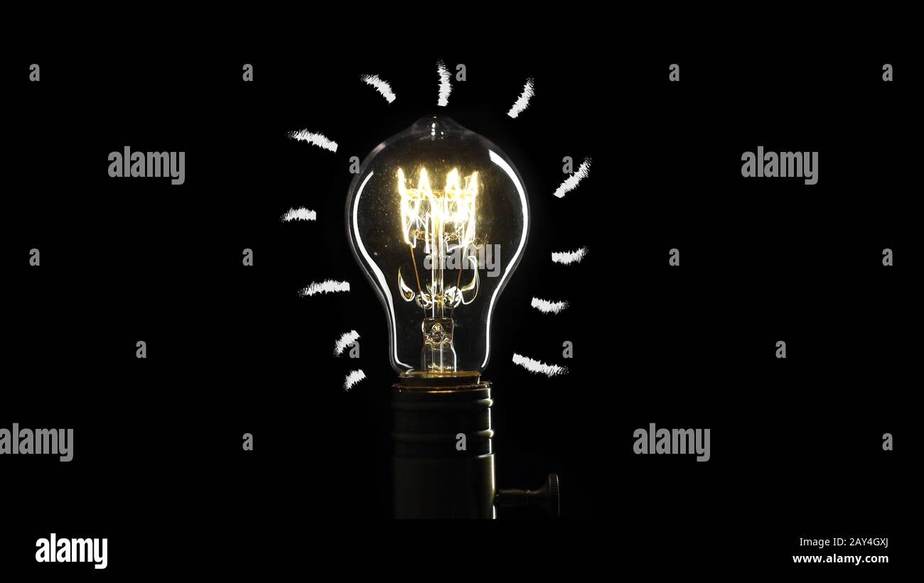 idea light bulb Flickering Tungsten light bulb lamp over black