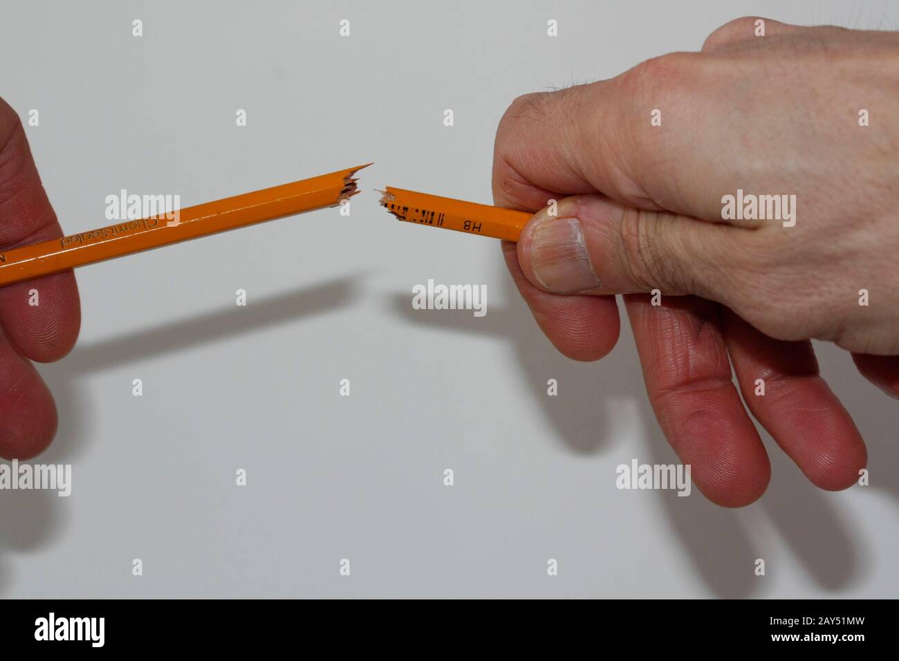 Breaking a pencil in half Stock Photo Alamy