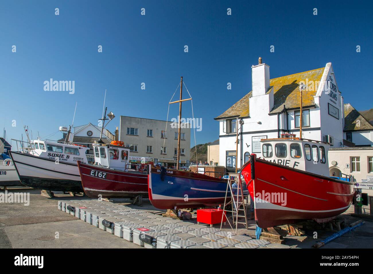 Lyme Regis fishing boats are out of the water in the harbour for winter