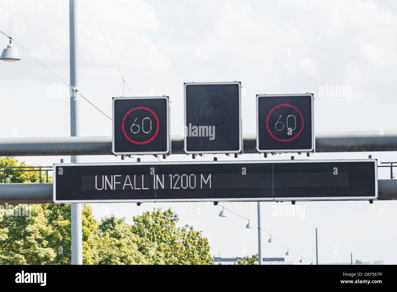 Electronic information display with speed limit warns about emergency situation ahead on a highway in Germany Stock Photo