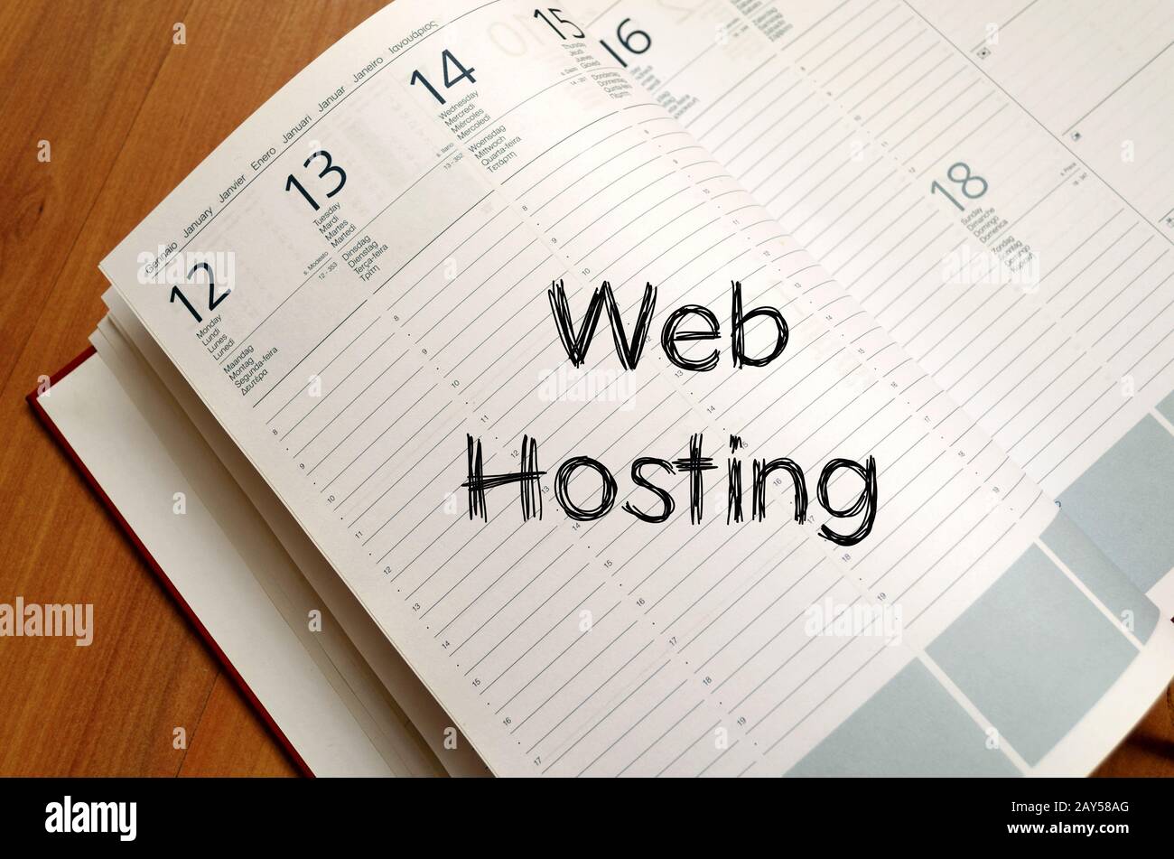 Web hosting write on notebook Stock Photo