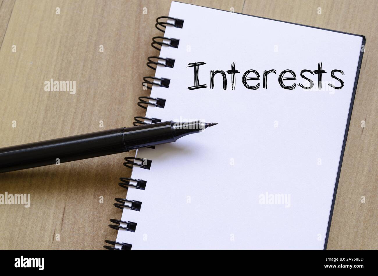 Interests write on notebook Stock Photo