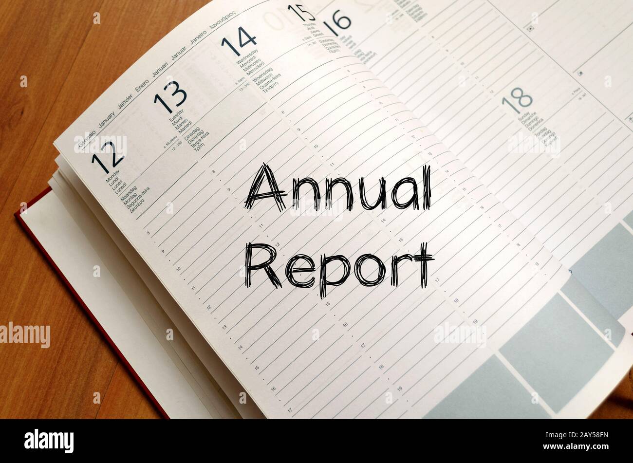 Annual report write on notebook Stock Photo - Alamy