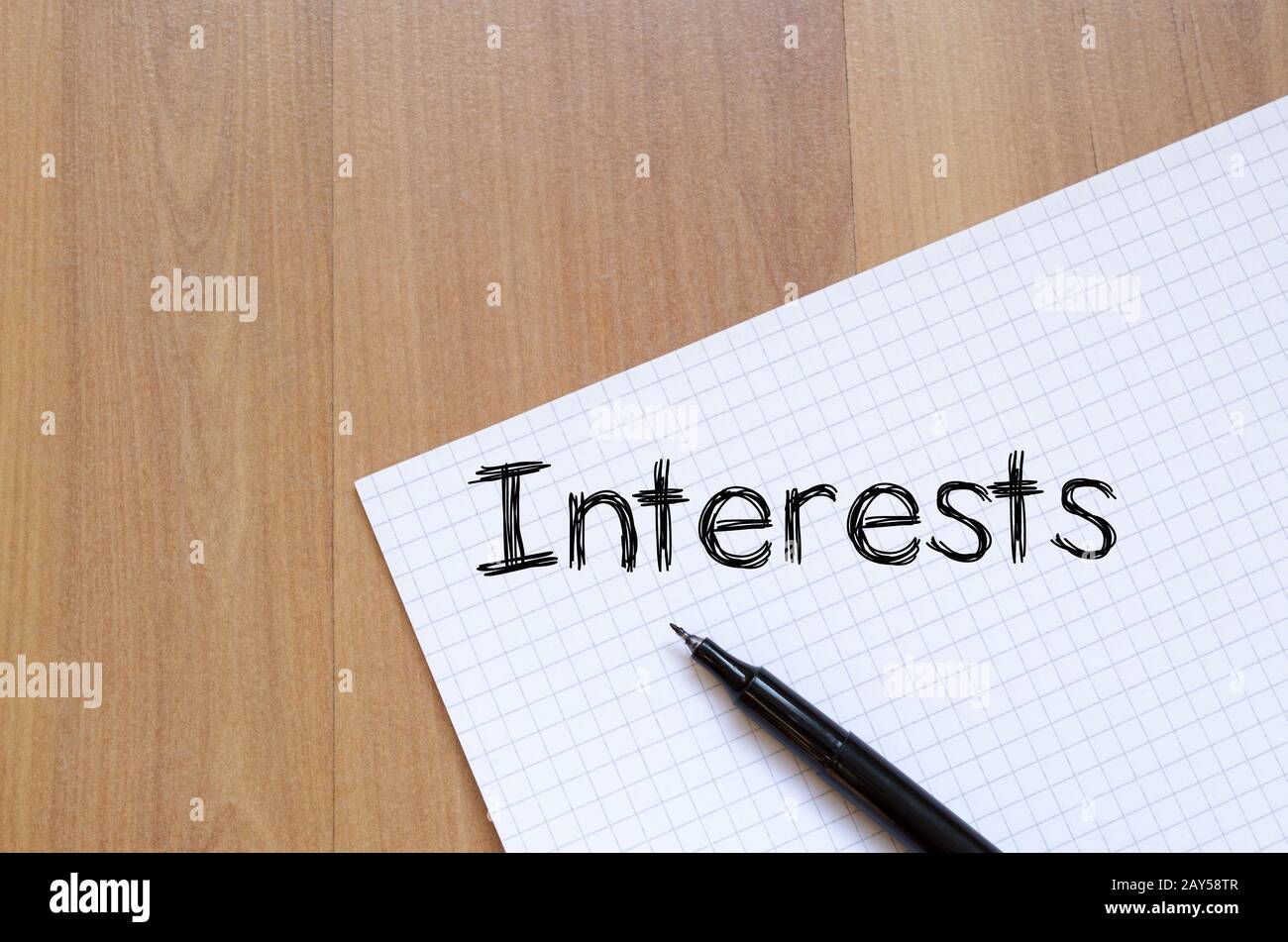 Interests write on notebook Stock Photo