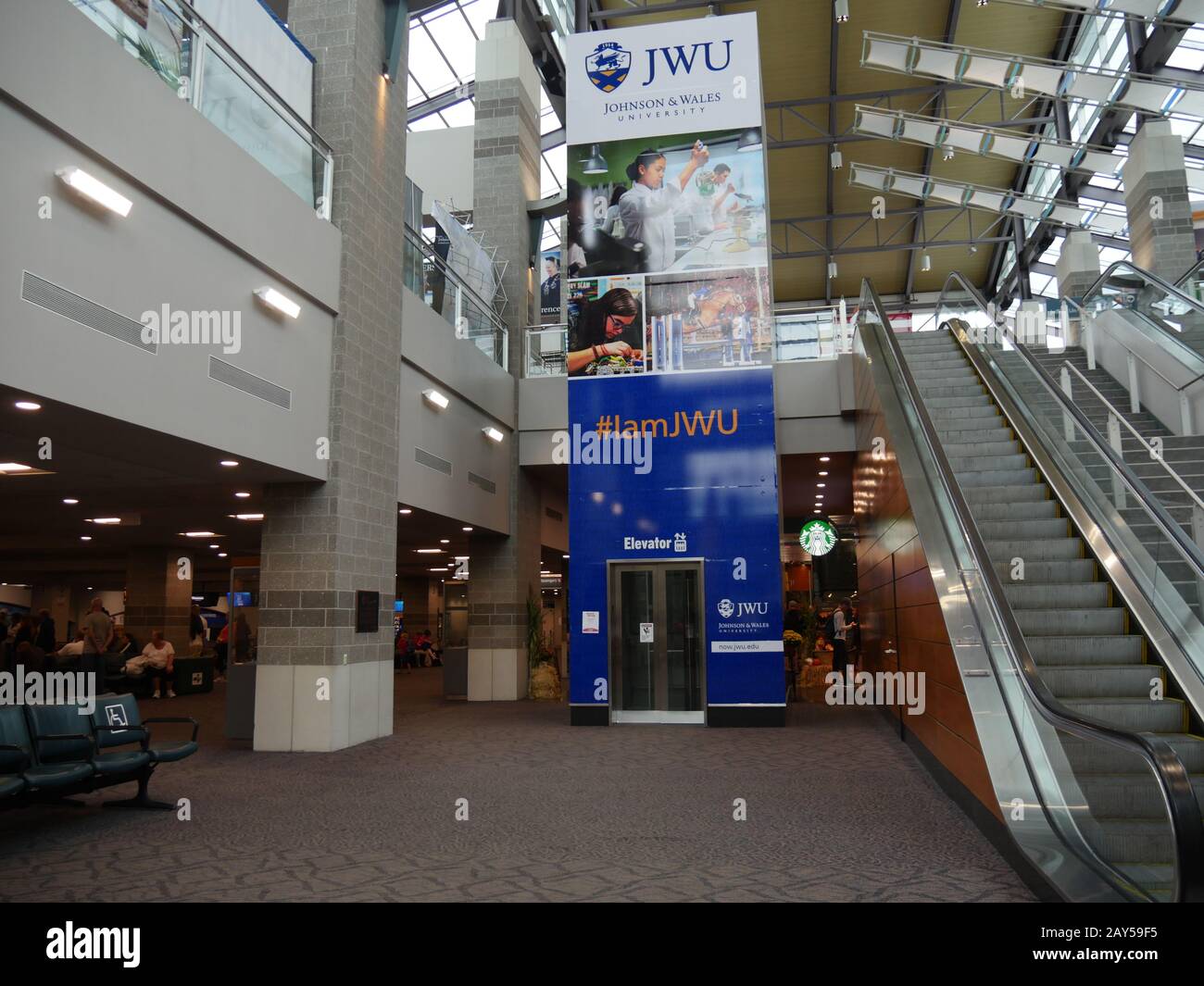 Warwick, Rhode Island-September 2017: Wide shot of waiting areas and escalators to the second floor of the T.F. Green Airport in Warwick. Stock Photo