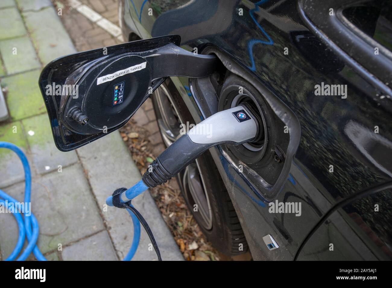 Electric vehicle plugged into charging port, The Hague, The Netherlands