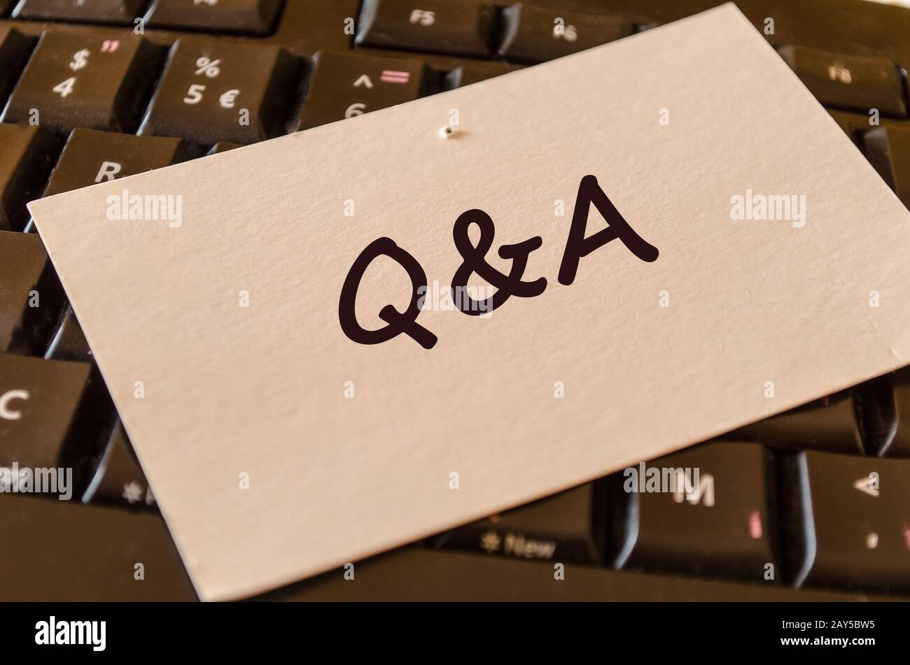 Qa text note Stock Photo