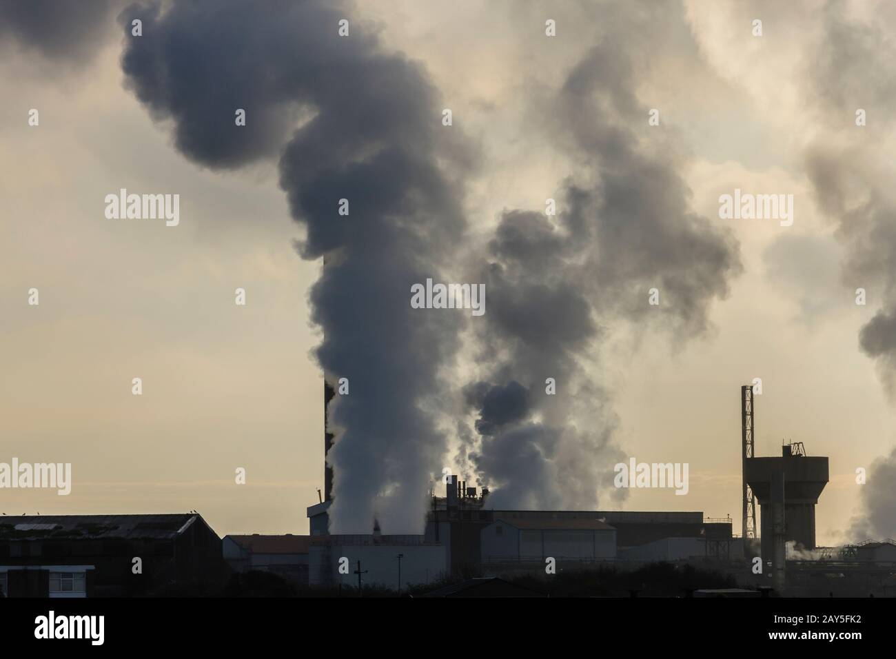 Port Talbot Steel Works emitting clouds of steam Port Talbot Swansea Glamorgan Wales Stock Photo